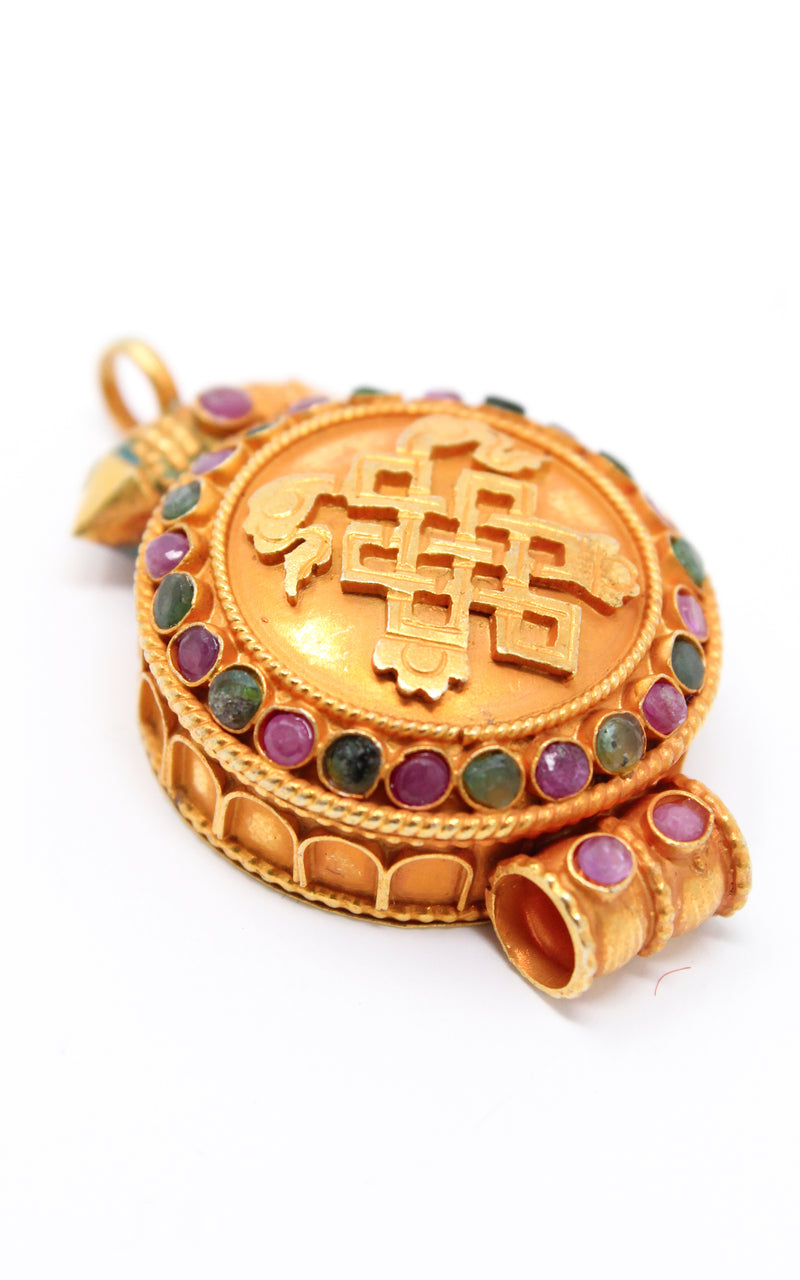 circular Gold Plated Endless Knot auspicious symbol Locket ruby emerald stones side close up