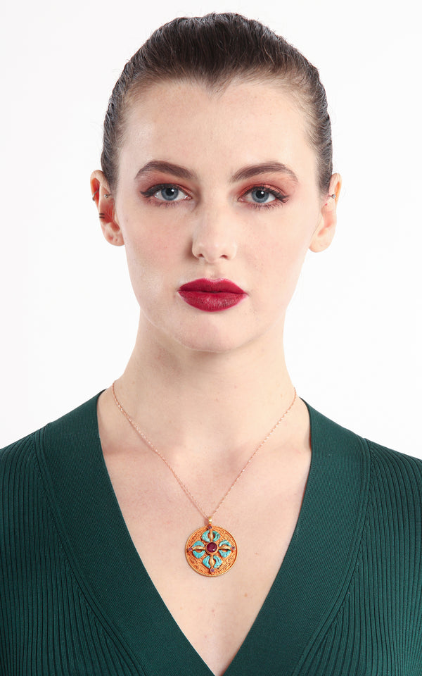 model wearing Circular Gold silver Double Dorjee thunderbolt Pendant turquoise coral ruby accents