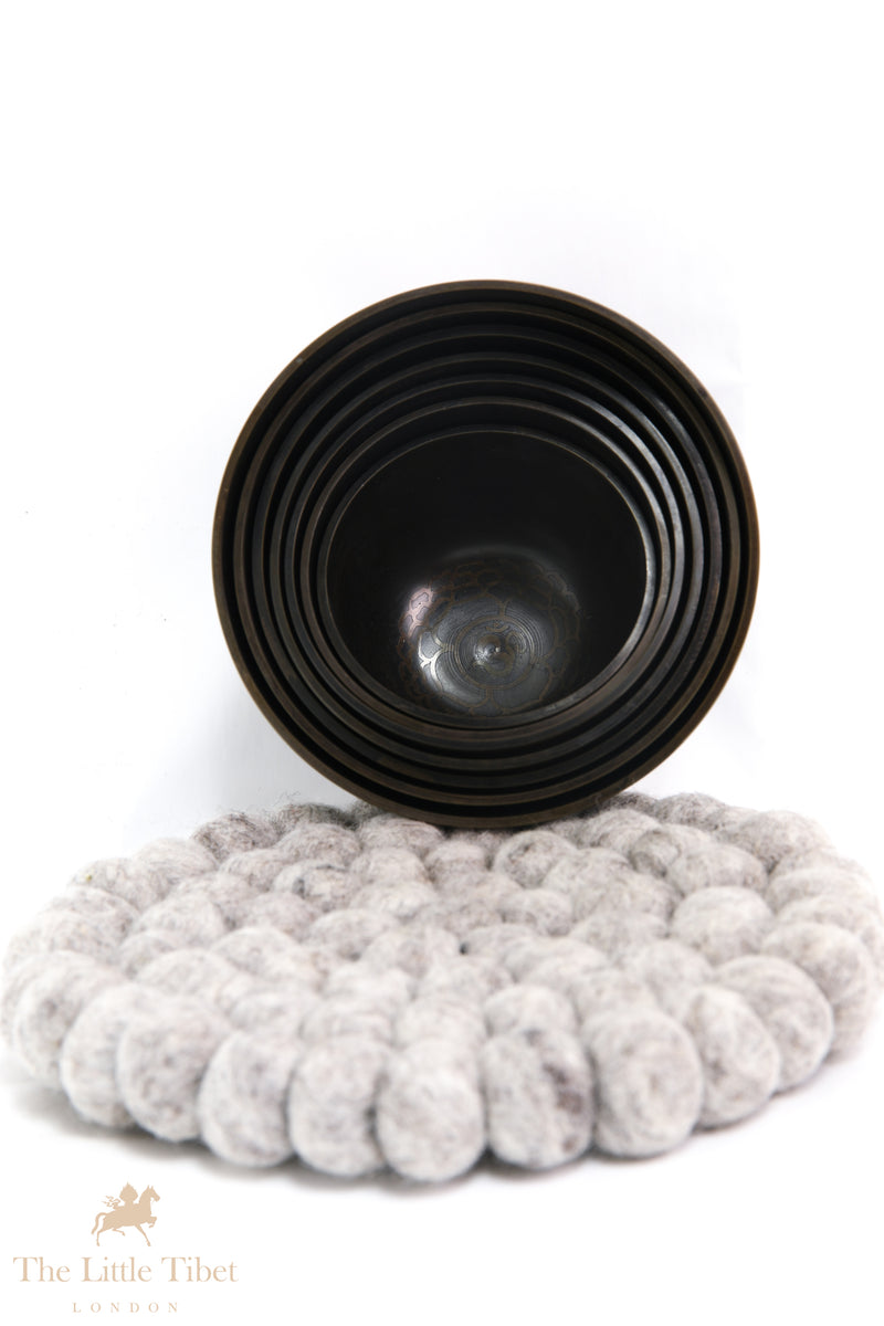 Serenity with the Nestling Seven Chakra Dark Tibetan Singing Bowl Set- 7 Chakra Nestling Dark