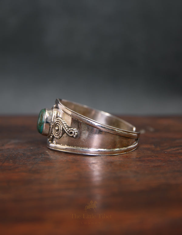 Chunky Tibetan Turquoise Bangle – Large Central Stone with Intricate Silver Design