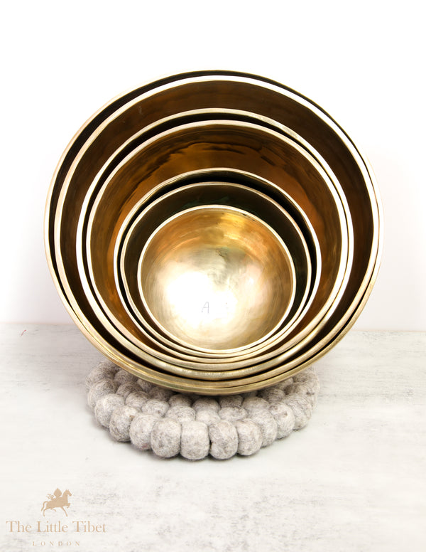 Discover Balance and Harmony with the Nestling Seven Chakra Tibetan Singing Bowl Set- Plain 7 Chakra Set