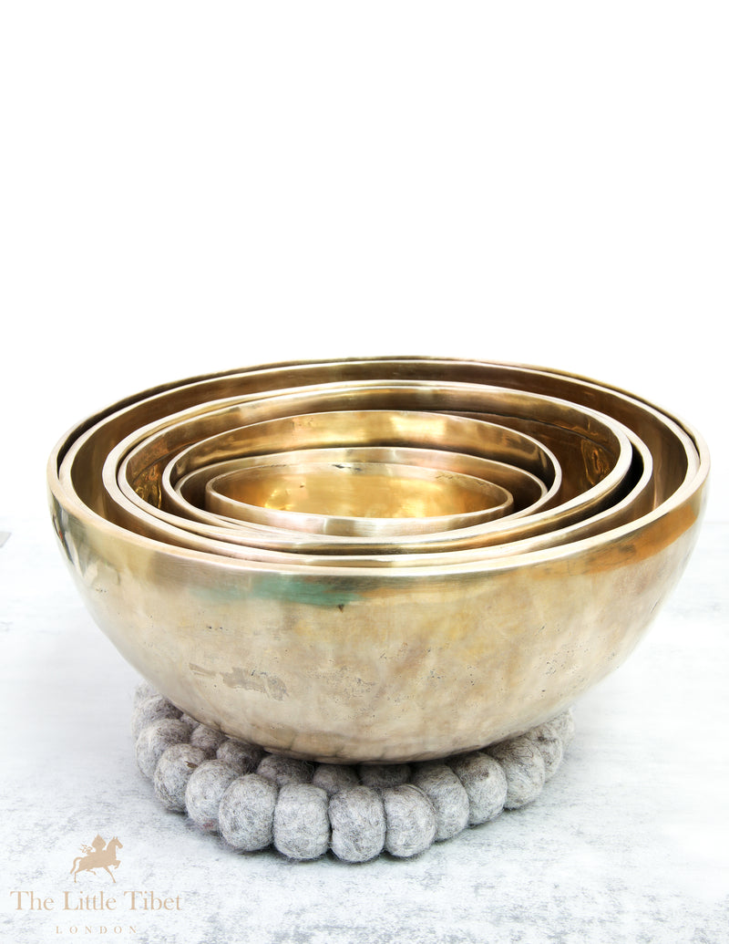 Discover Balance and Harmony with the Nestling Seven Chakra Tibetan Singing Bowl Set- Plain 7 Chakra Set