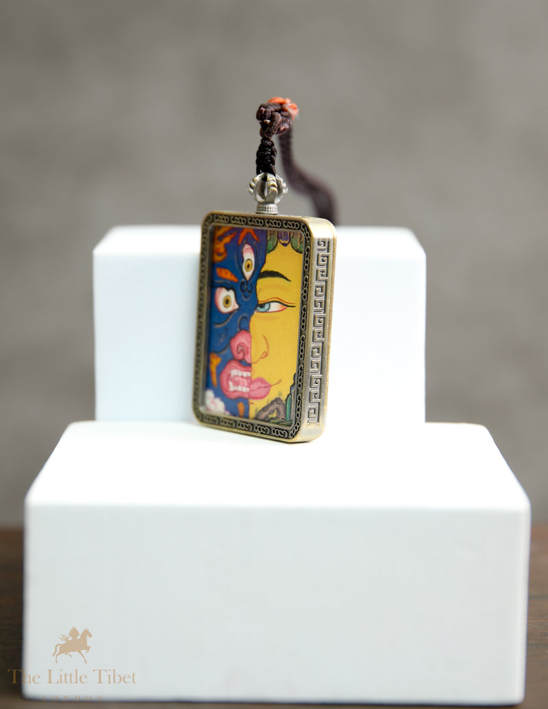 Dual faces of Budha: Hand-Painted Tibetan Pendant