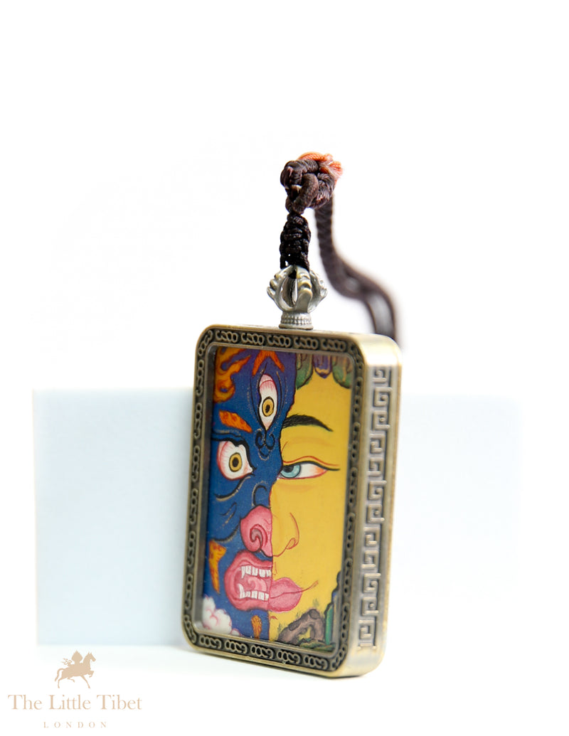 Dual faces of Budha: Hand-Painted Tibetan Pendant