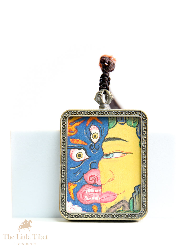 Dual faces of Budha: Hand-Painted Tibetan Pendant