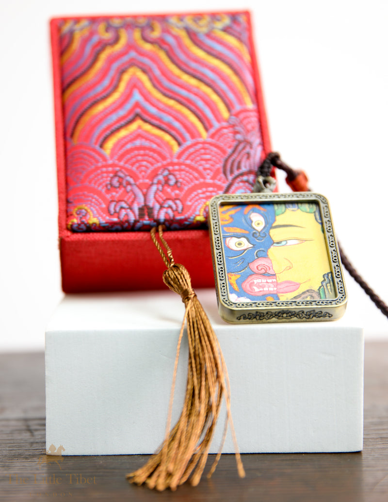 Dual faces of Budha: Hand-Painted Tibetan Pendant