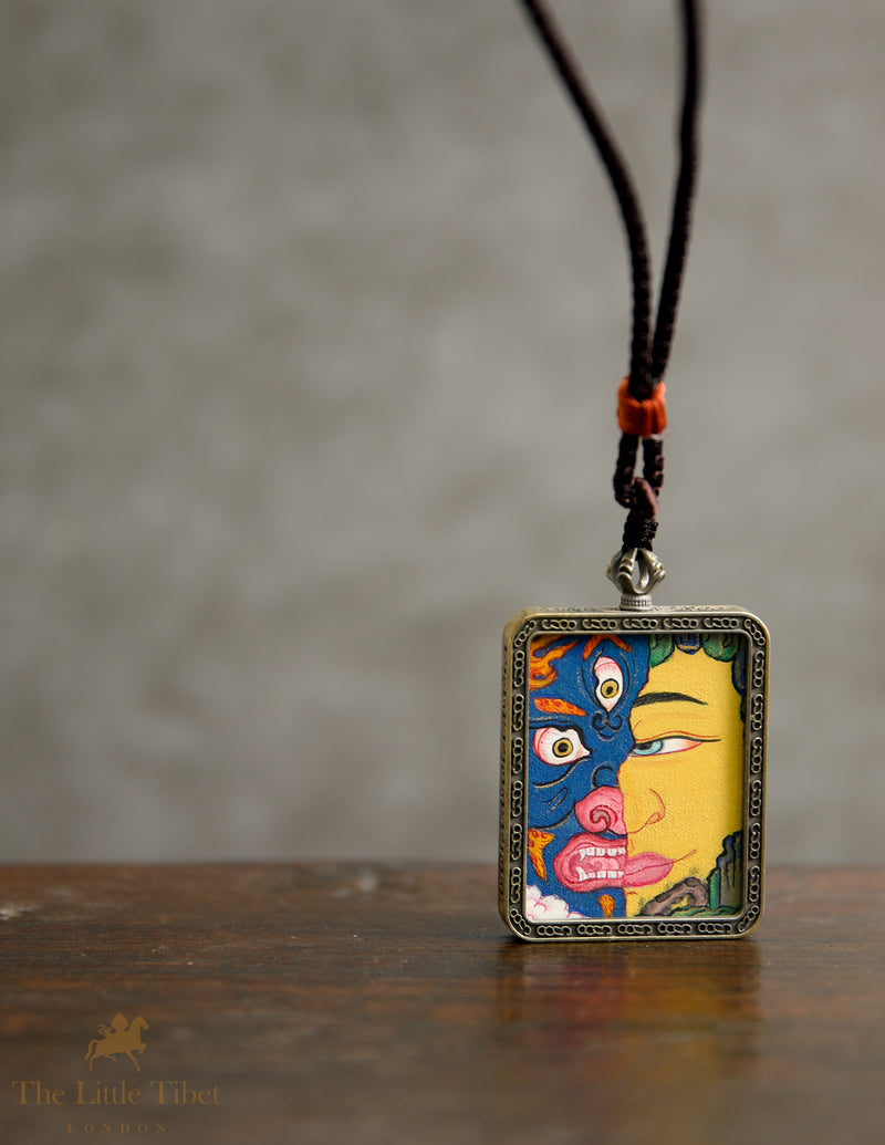 Dual faces of Budha: Hand-Painted Tibetan Pendant