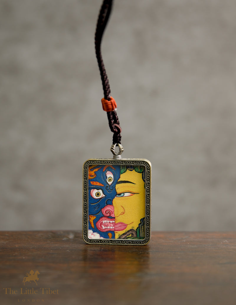 Dual faces of Budha: Hand-Painted Tibetan Pendant