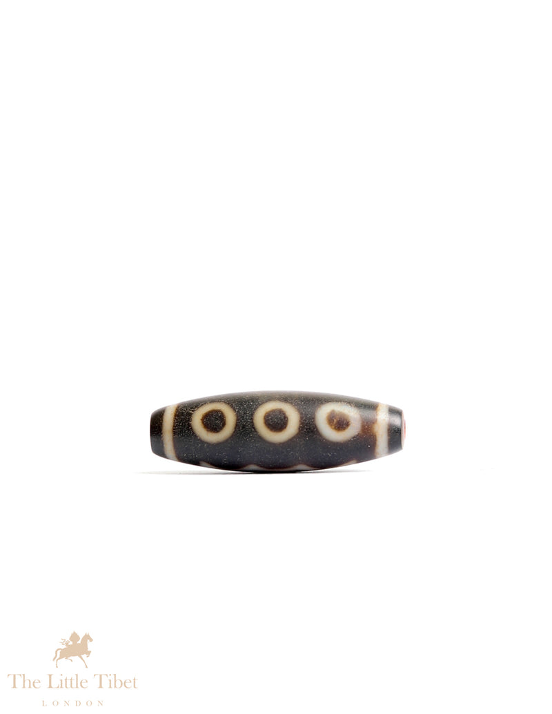 Sacred Tibetan Dzi Bead: Symbol of Spiritual Protection and Harmony