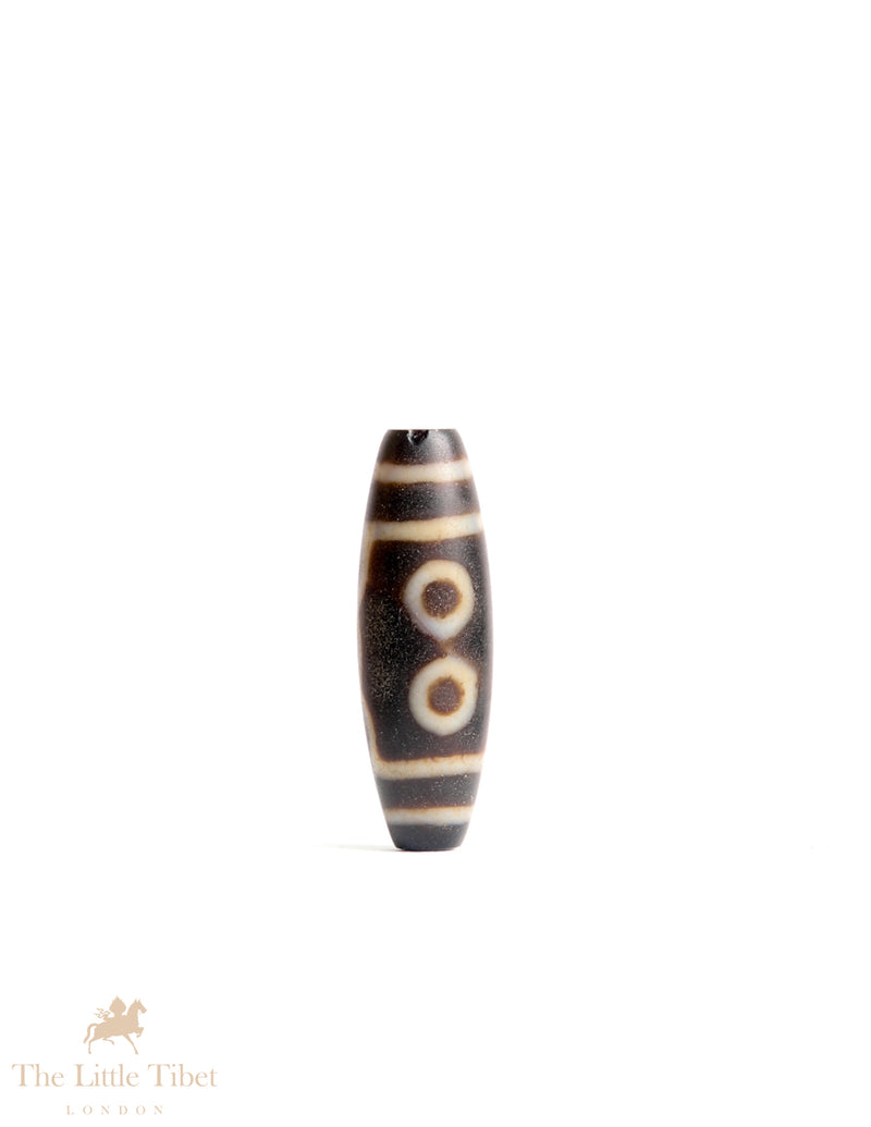 Sacred Tibetan Dzi Bead: Symbol of Spiritual Protection and Harmony