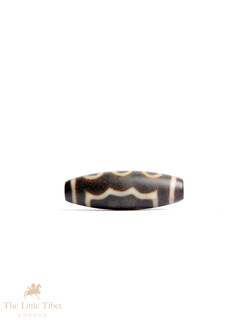 Sacred Tibetan Dzi Bead: Symbol of Spiritual Protection and Harmony