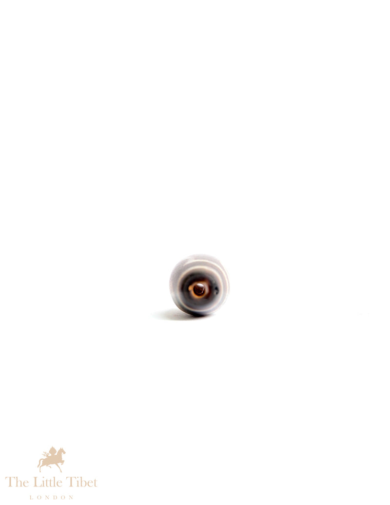 Sacred Tibetan Dzi Bead: Symbol of Spiritual Protection and Harmony