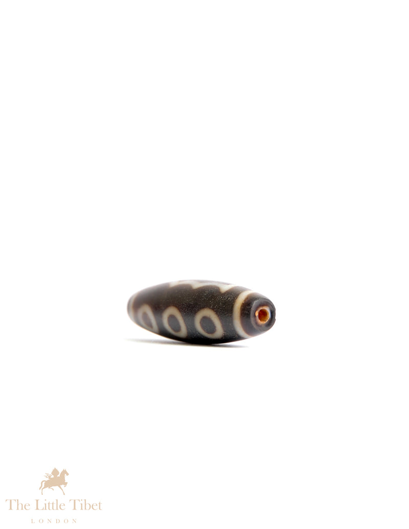 Sacred Tibetan Dzi Bead: Symbol of Spiritual Protection and Harmony