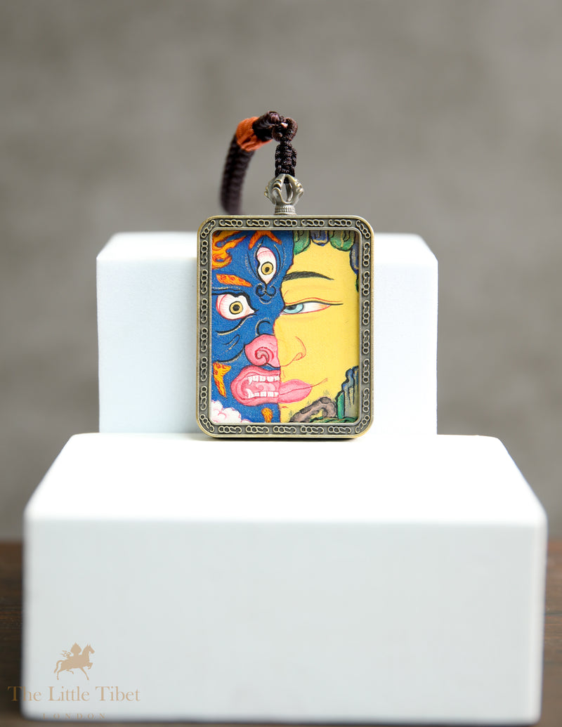 Dual faces of Budha: Hand-Painted Tibetan Pendant