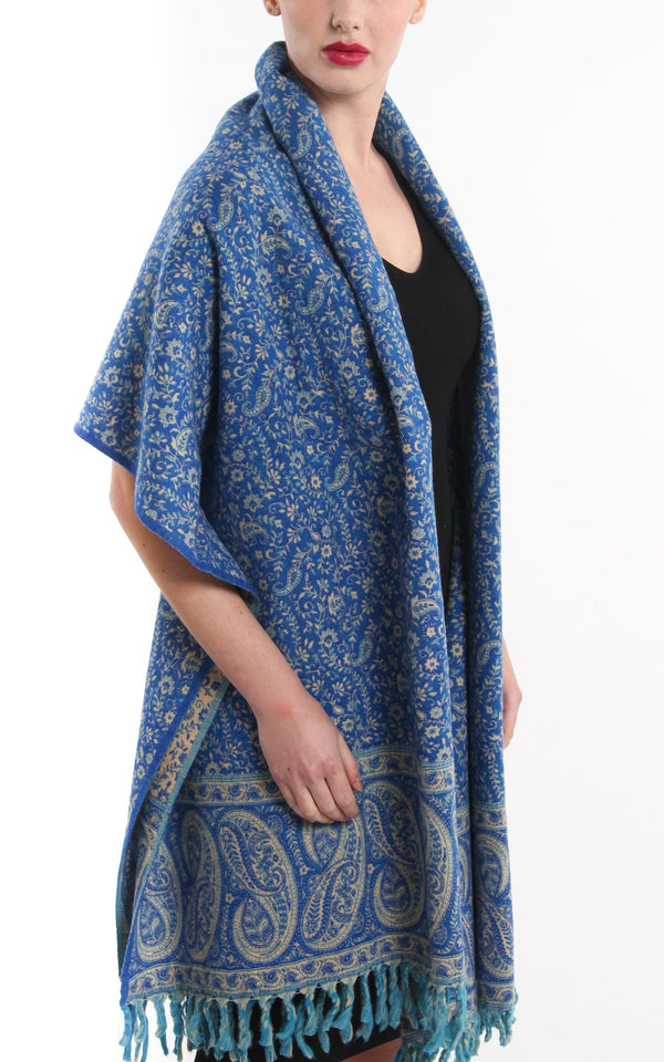  lapis lazuli blue  cream paisley design reversible tibet shawl  tassels draped around shoulders