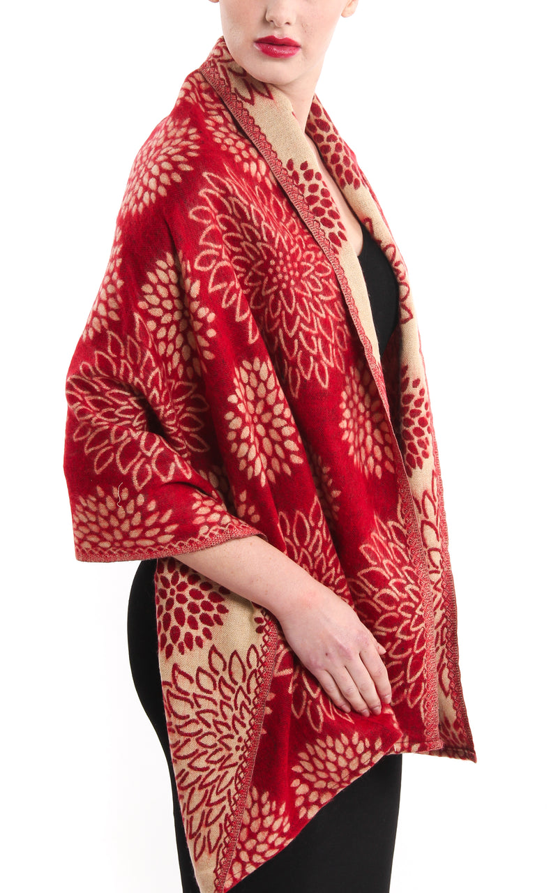 red cream crysanthemum floral patterned reversible Himalayan tibet knit shawl  draped around shoulders