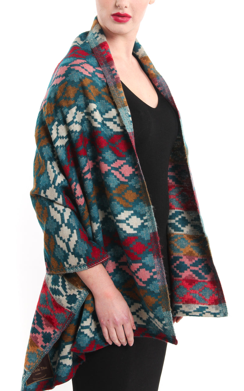 Geometric patterned overlay Himalayan reversible Tibet shawl draped around shoulders