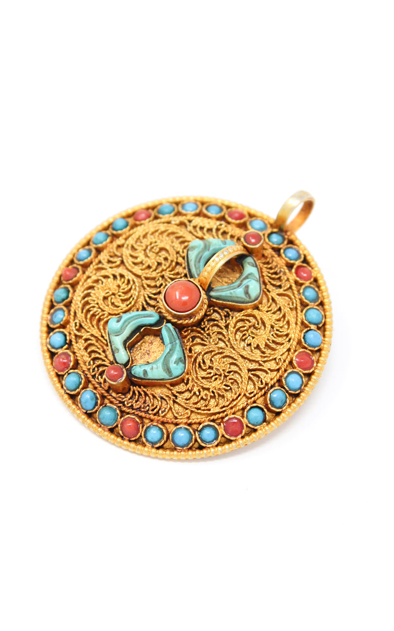 Circular Gold Dorjee Pendant turquoise coral ruby emerald gems close up