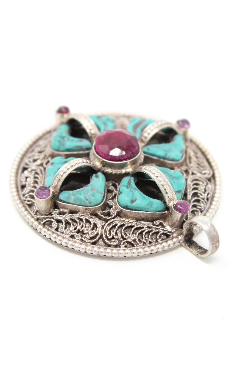 double dorjee turquoise coral thunderbolt pendant close up handmade tibetan jewellery  
