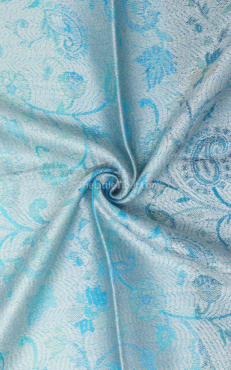 Close up of the reversible Aqua Sea Blue Pure Silk Pashmina with the silver paisley side 