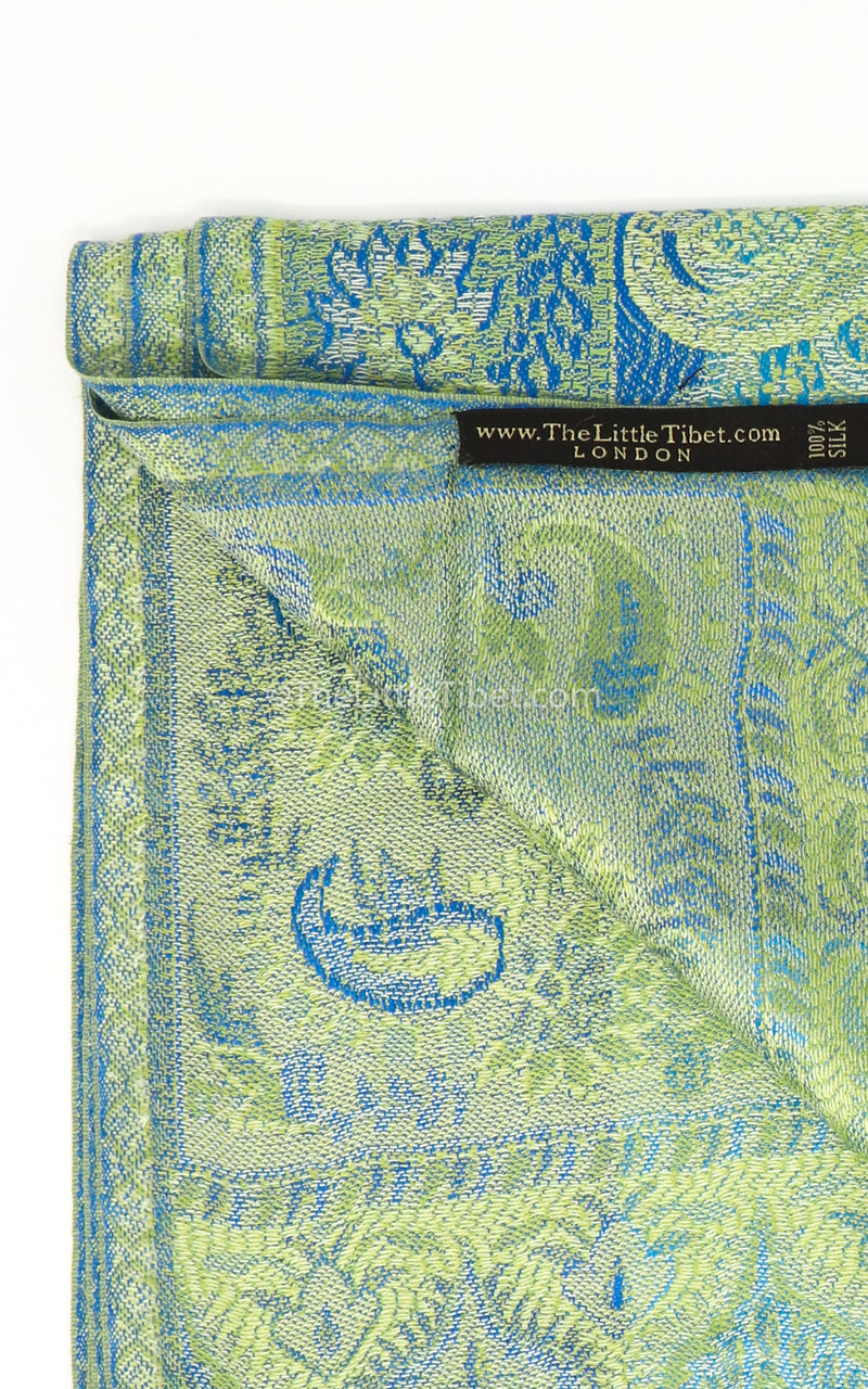 Close up of inside of the Vibrant green pure silk pashmina with blue paisley detail