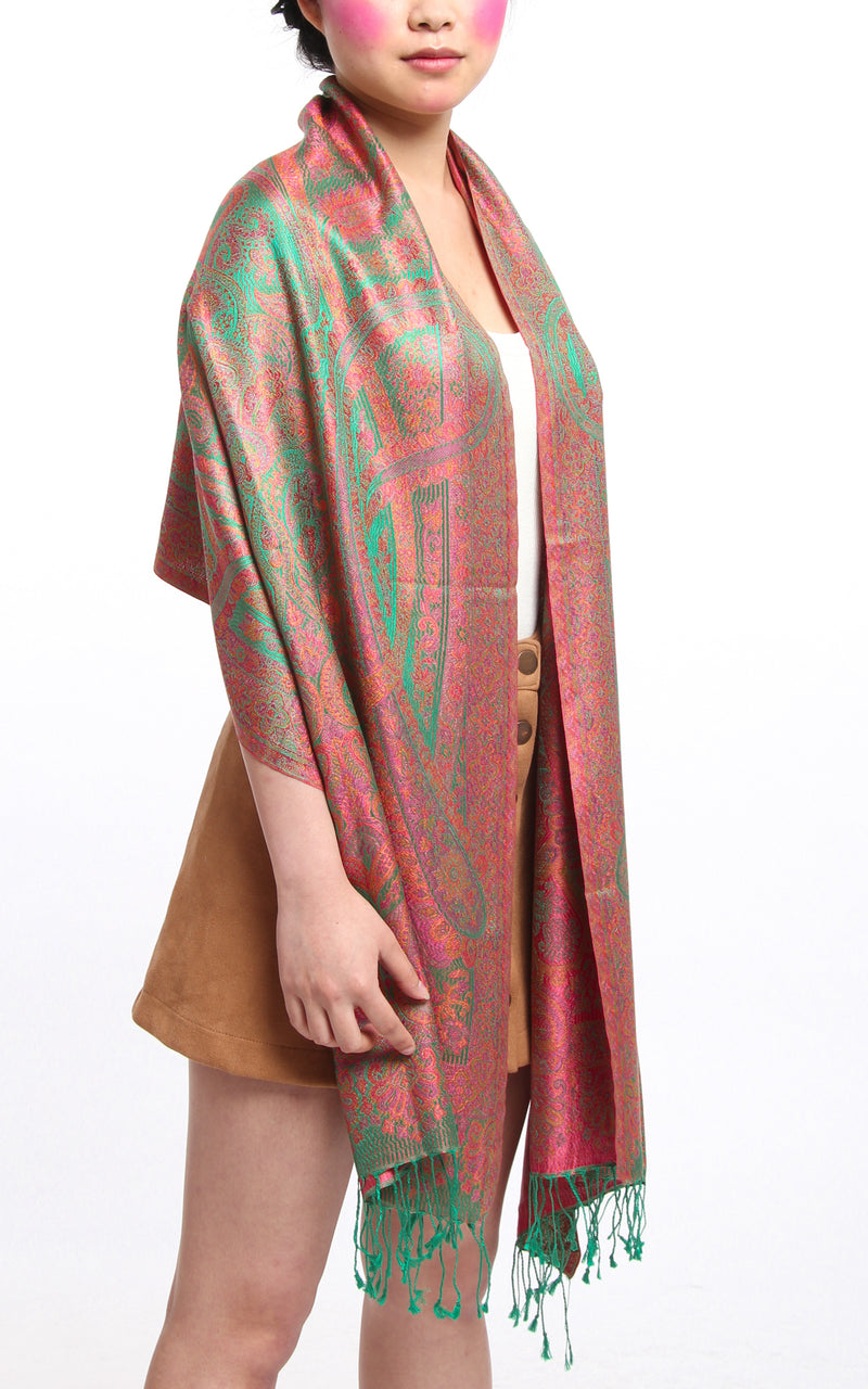 Emerald Green 100% Silk Pashmina silk scarf with orange pink Paisley Design draped around the shoulders