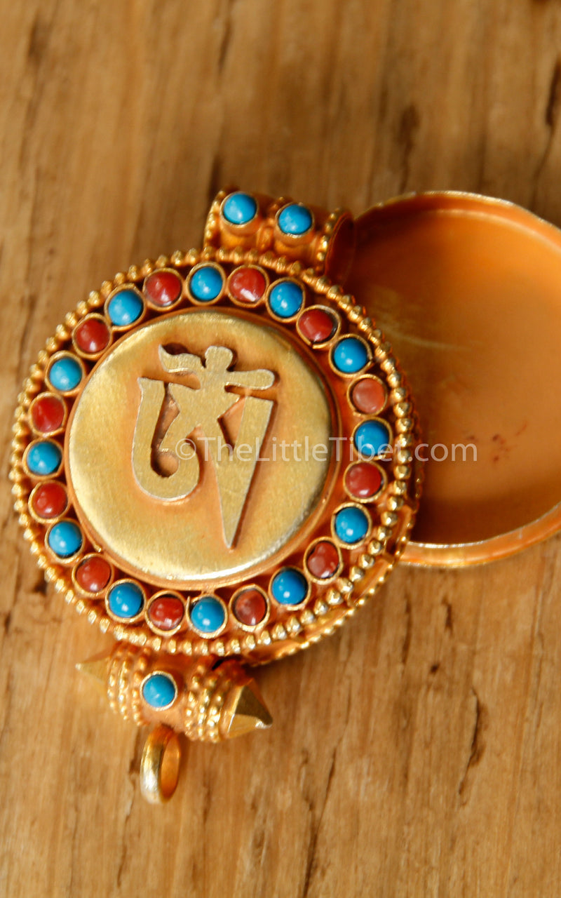 circular Gold Om Locket Pendant turquoise coral detail close up