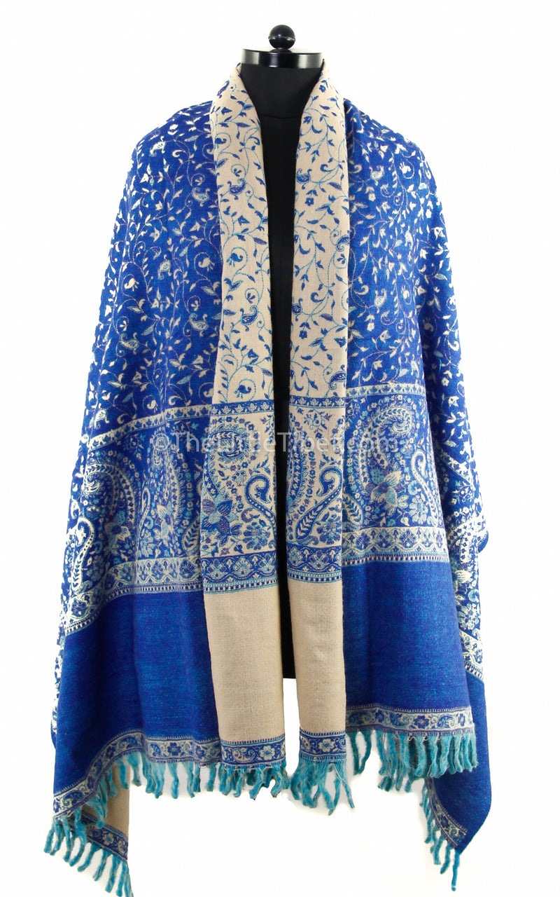 lapis lazuli cream paisley design reversible tibet shawl with tassels  draped around shoulders