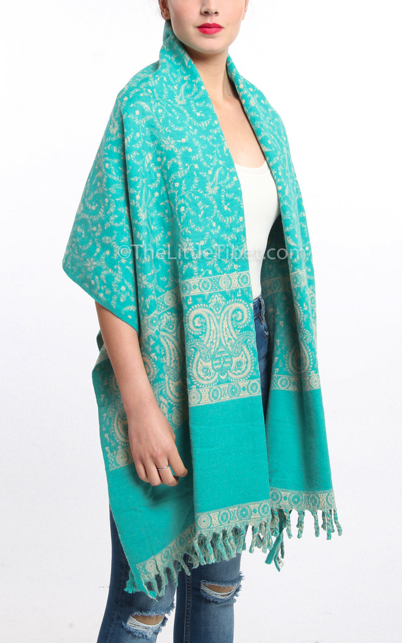 Light Aqua blue cream paisley design tibet shawl chunky knit draped around shoulders