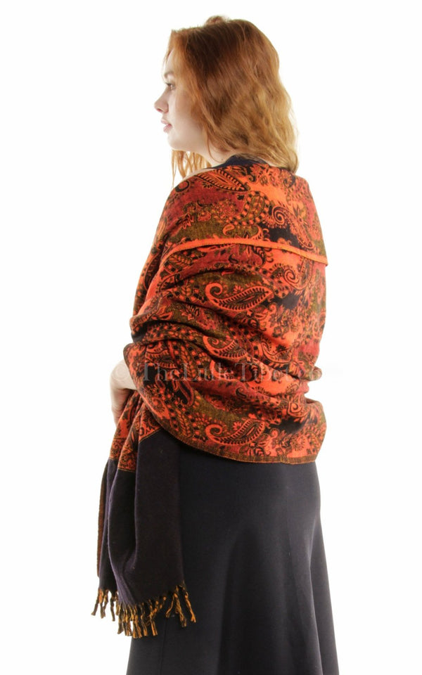 Burnt orange  paisley design reversible himalayan tibet wool shawl  draped around shoulders
