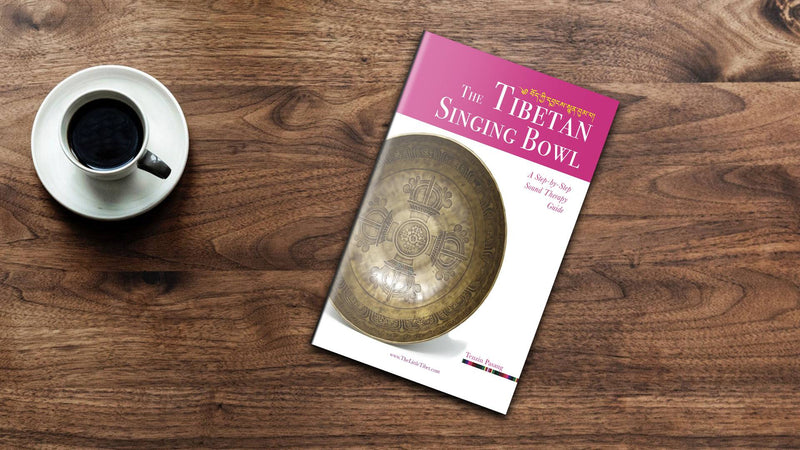 flatlay shot  of  The Tibetan Singing Bowl Book Guide for reiki healing, sound therapy, yoga meditation