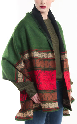 Reversible rose red forest green modernistic design with borders tibet shawl chunky knit draped around shoulders