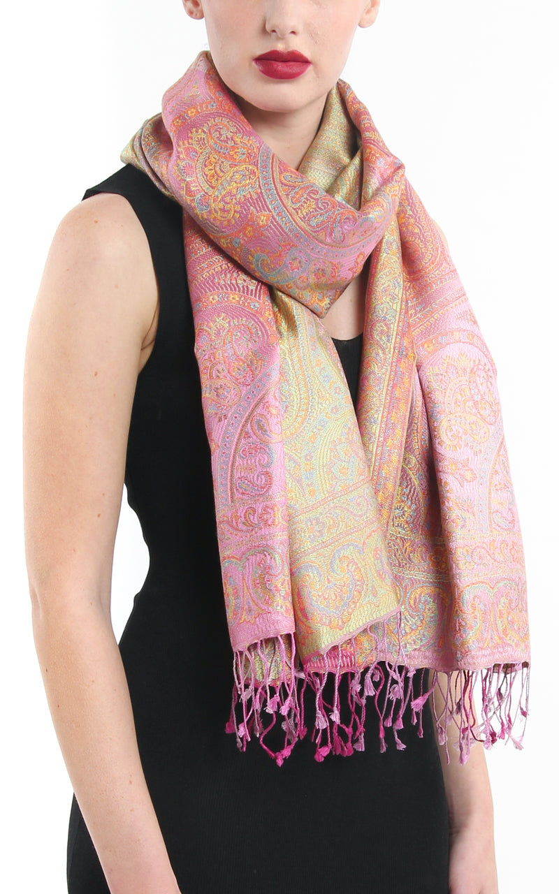 Pale Pastel Pink Paisley patterned pure reversible silk pashmina with  gold accents and tassels styled around necj