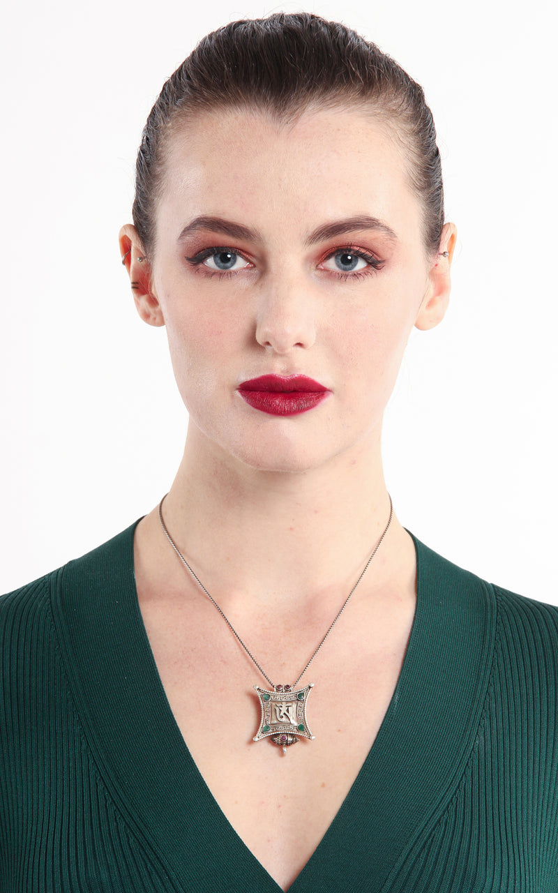 model wearing Silver Om Locket Pendant emerald ruby beads handmade tibetan jewellery 