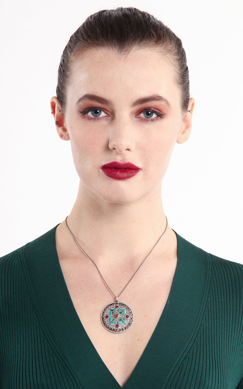 model wearing Circular Gold Double Dorjee Pendant turquoise coral accents
