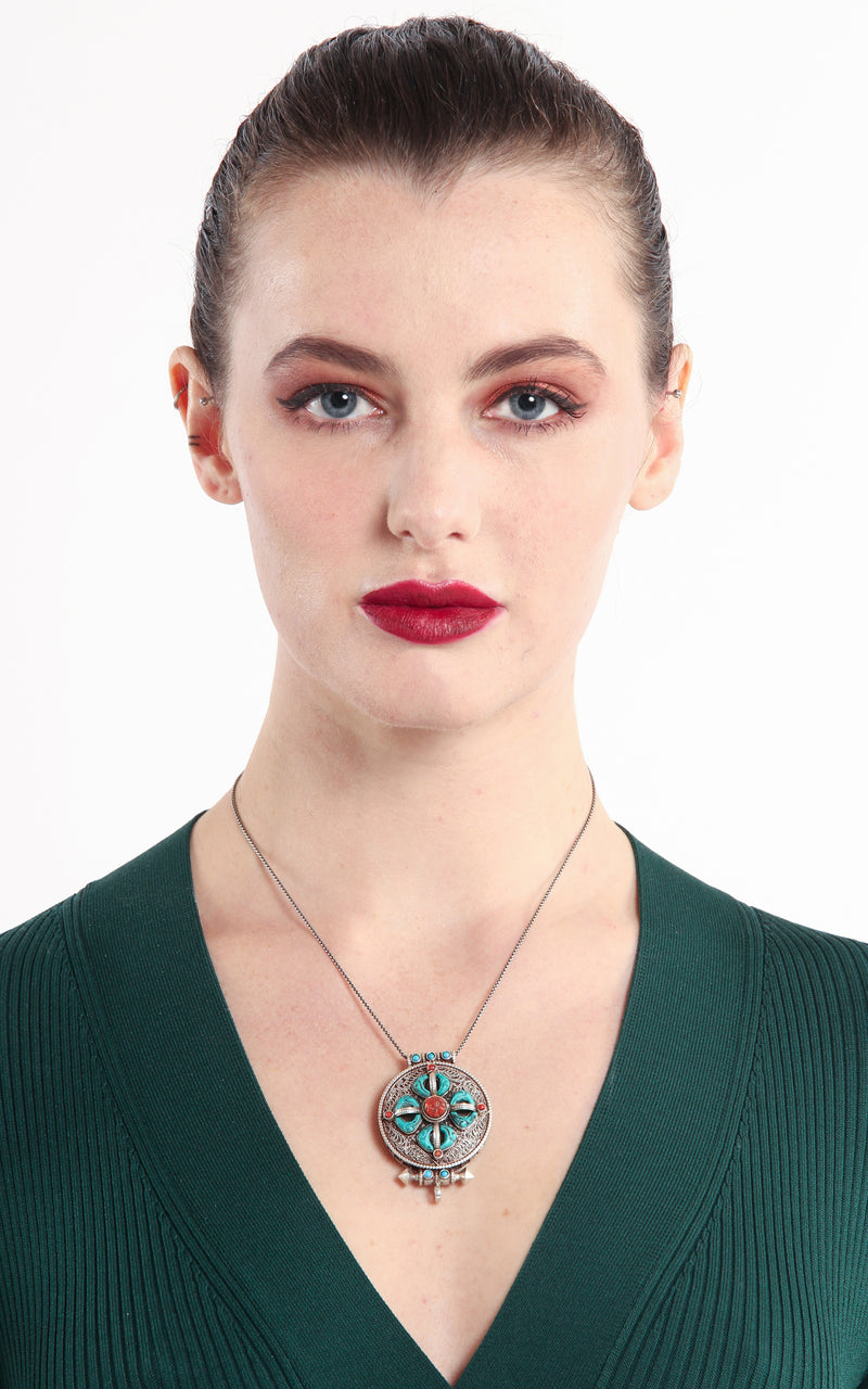 model wearing Double Dorjee Locket Pendant handmade Tibetan silver Pendant turquoise coral stones